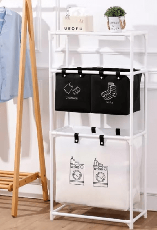 Scaffale Portabiancheria, 3 Livelli con 4 Scomparti, 115x55x25 cm Struttura in Metallo Bianco, Cesto Biancheria con Sacchi Estraibili